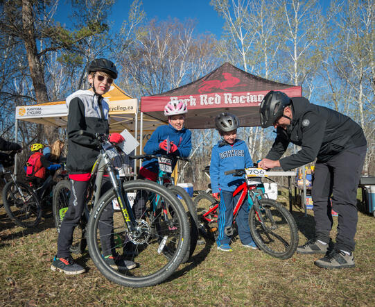 KOM youth participants with parent volunteer